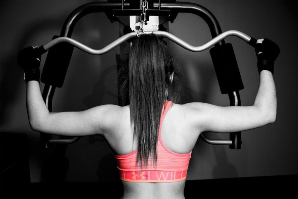 woman working out to show how to get rid of back fat